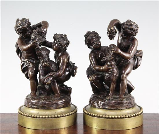 A pair of late 19th / early 20th century patinated bronze putti groups, 9.25in.